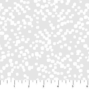 White polka dots on a gray background with a ruler at the bottom.