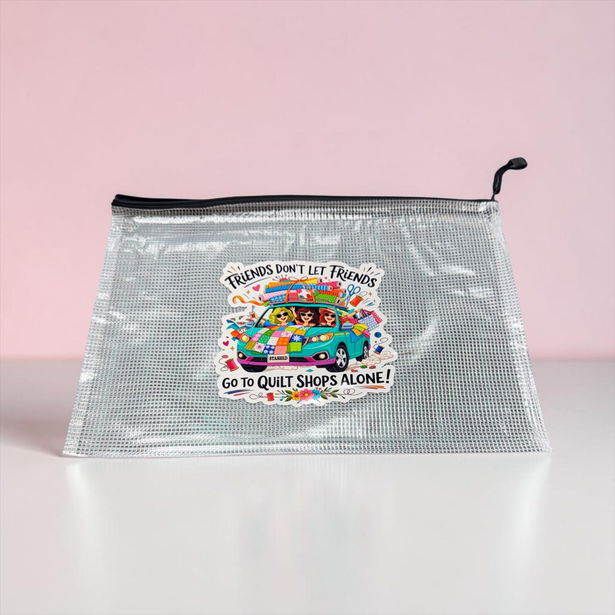 Clear pouch with colorful graphic and text on a pink background