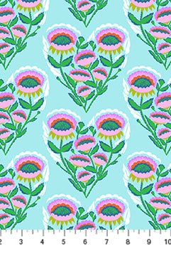Pattern of colorful floral designs on a blue background with a ruler at the bottom.