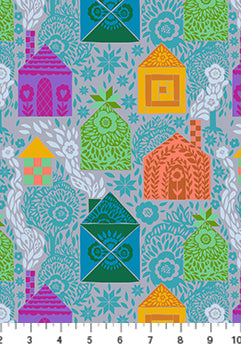 Colorful pattern of stylized houses and geometric shapes on a fabric swatch.