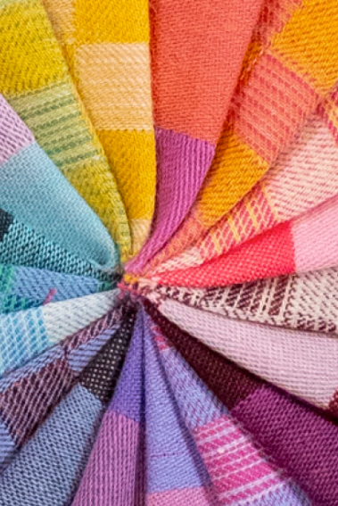 Color swatch with various fabric textures and colors arranged in a circular pattern.