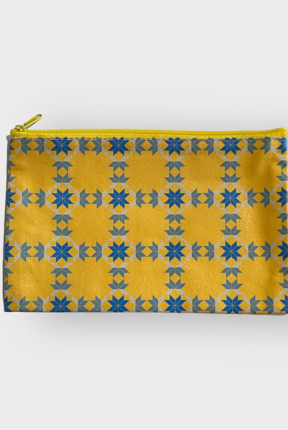 Yellow pouch with blue star pattern on a white background