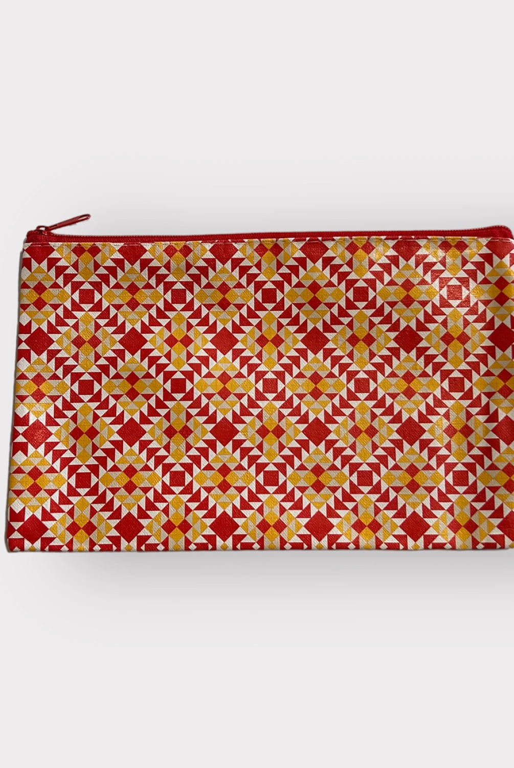 Pouch with red and yellow geometric pattern on a white background