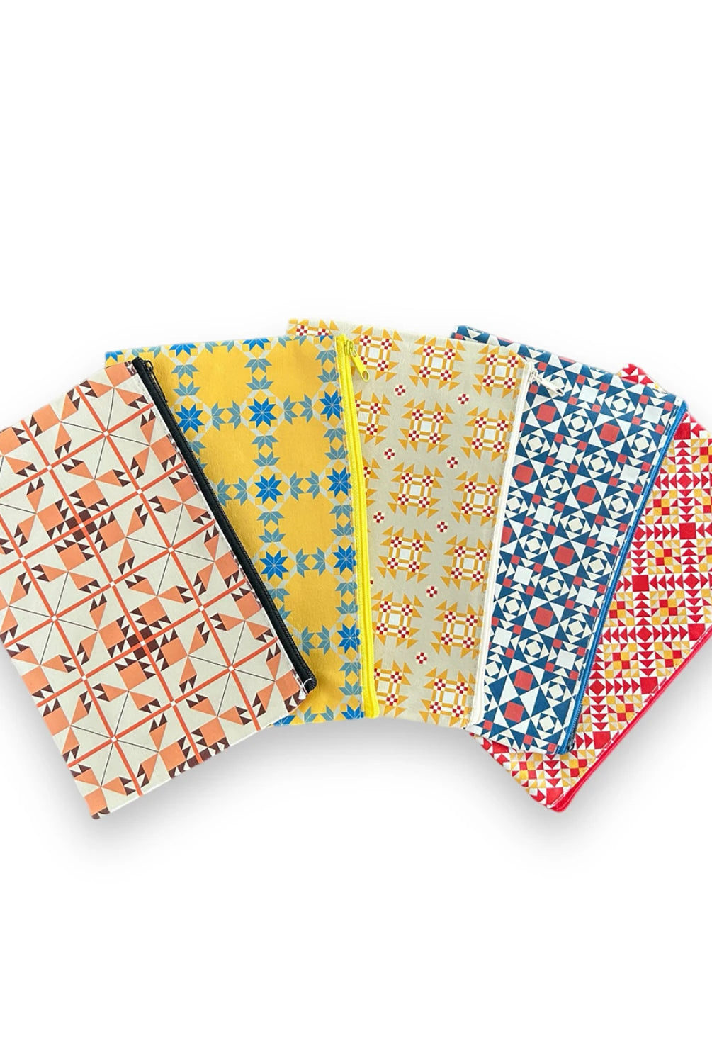 Set of five patterned notebooks on a white background