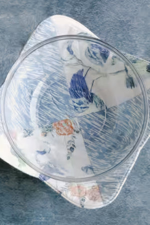 Glass bowl with floral pattern on a textured blue surface Color Blocked Bowl Cozy -Size 13" x 13" Designed By Carolina Moore - Carmon's Quilt Shop