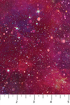 Fabric with a starry night sky pattern in pink and purple tones.