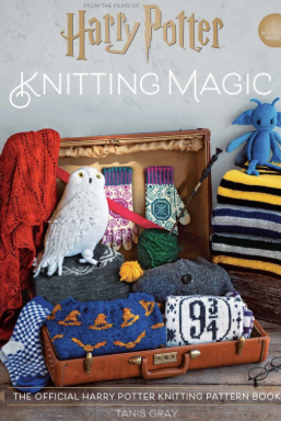 Book cover of 'Knitting Magic' featuring knitted items and a owl on a wooden surface.