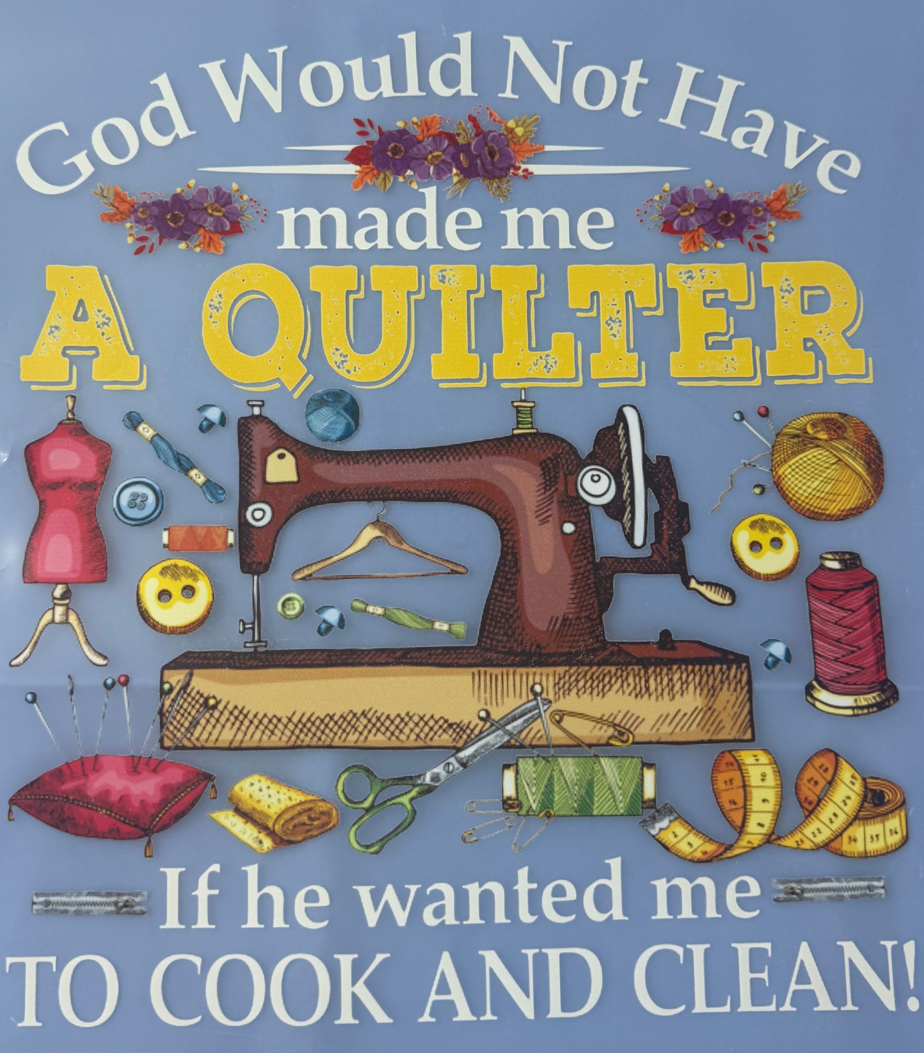 Blue towel with sewing-themed design and text on a blue background