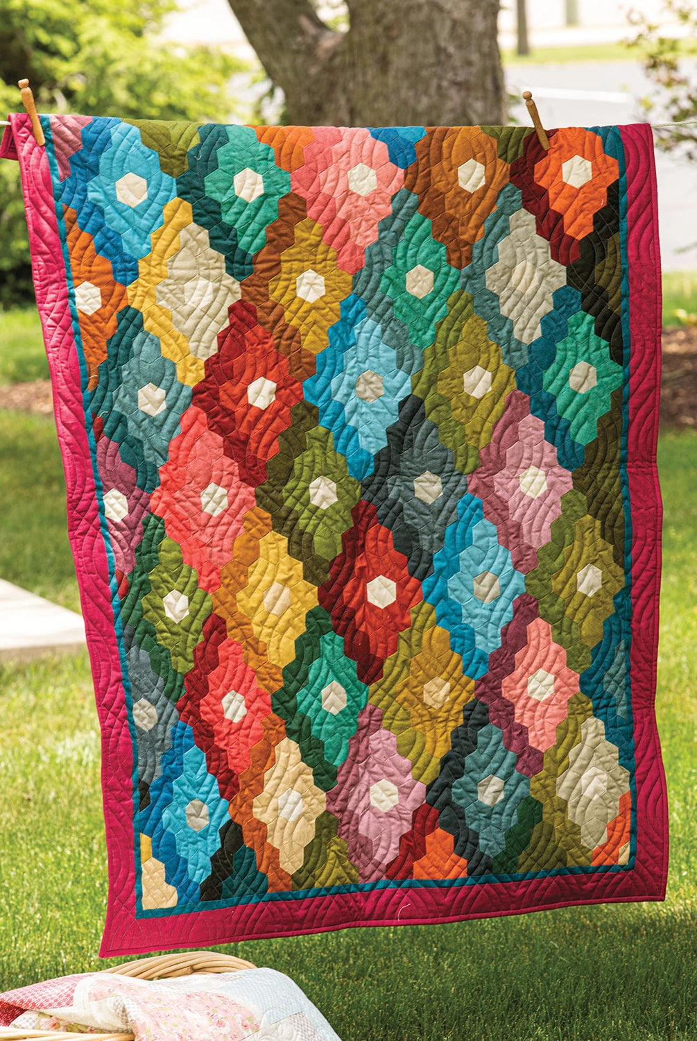 Colorful quilt hanging outdoors on a clothesline. Quilt Pattern
