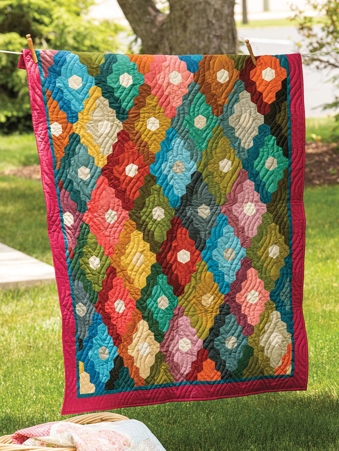 Colorful quilt hanging outdoors on a clothesline. Quilt Pattern