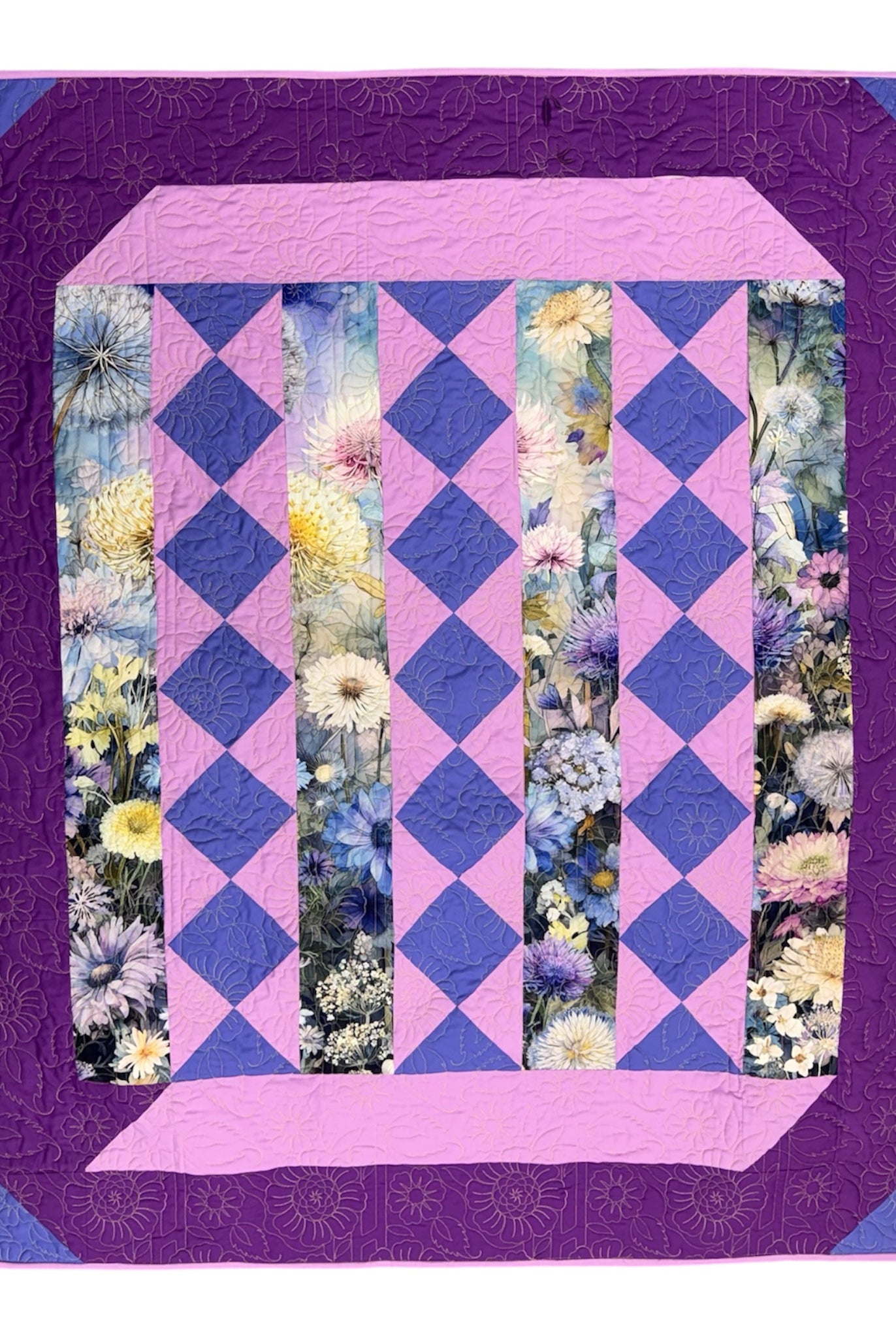 Quilt with purple and pink diamond pattern and floral border on a white Lovely Flowers Quilt Kit Finished Size - Northcott/Timeless Treasures Fabric 49.75" x 60" -Carmons Quilt Shopbackground