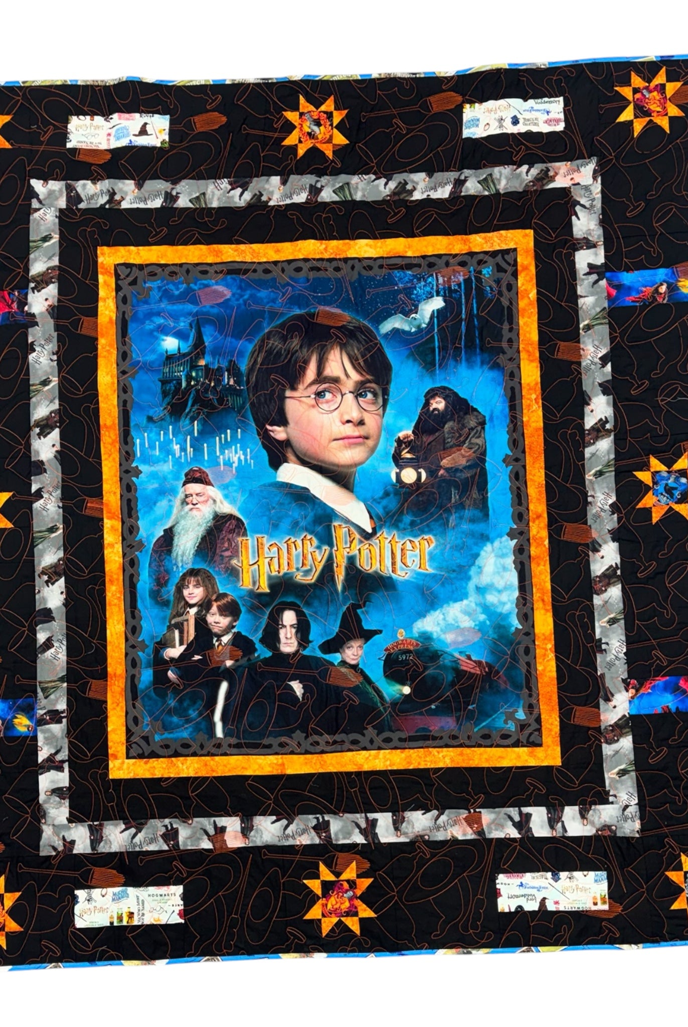 Harry Potter-themed quilt with characters and text on a black background