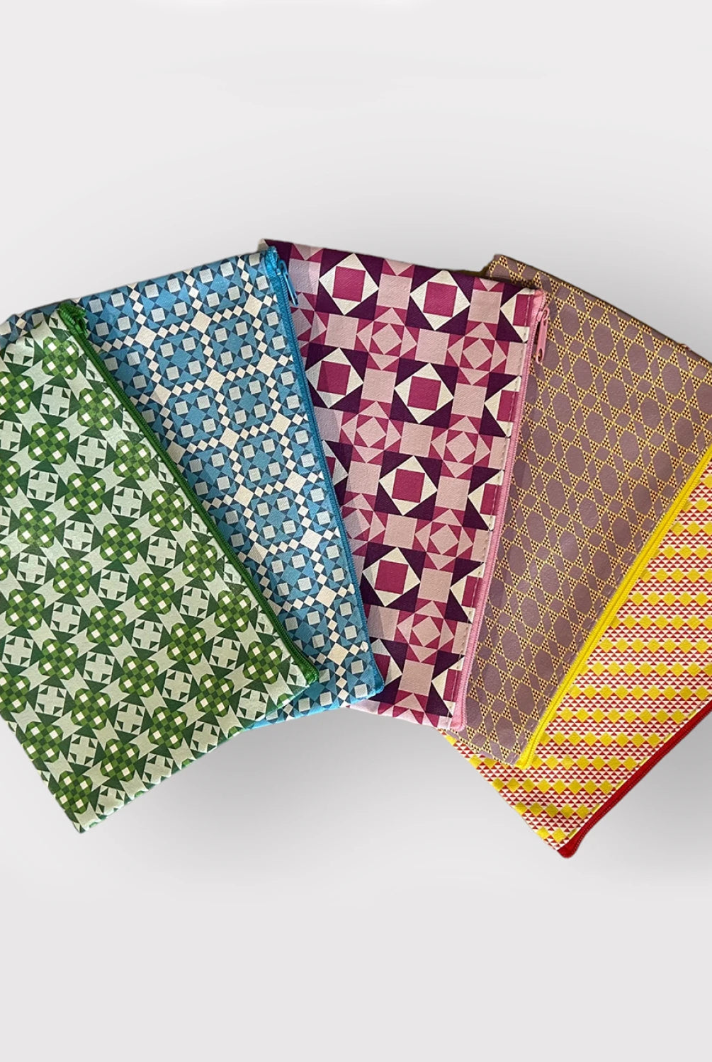Four patterned fabric swatches arranged in a row on a light gray background