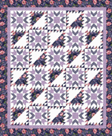 Quilt with geometric pattern on a floral background