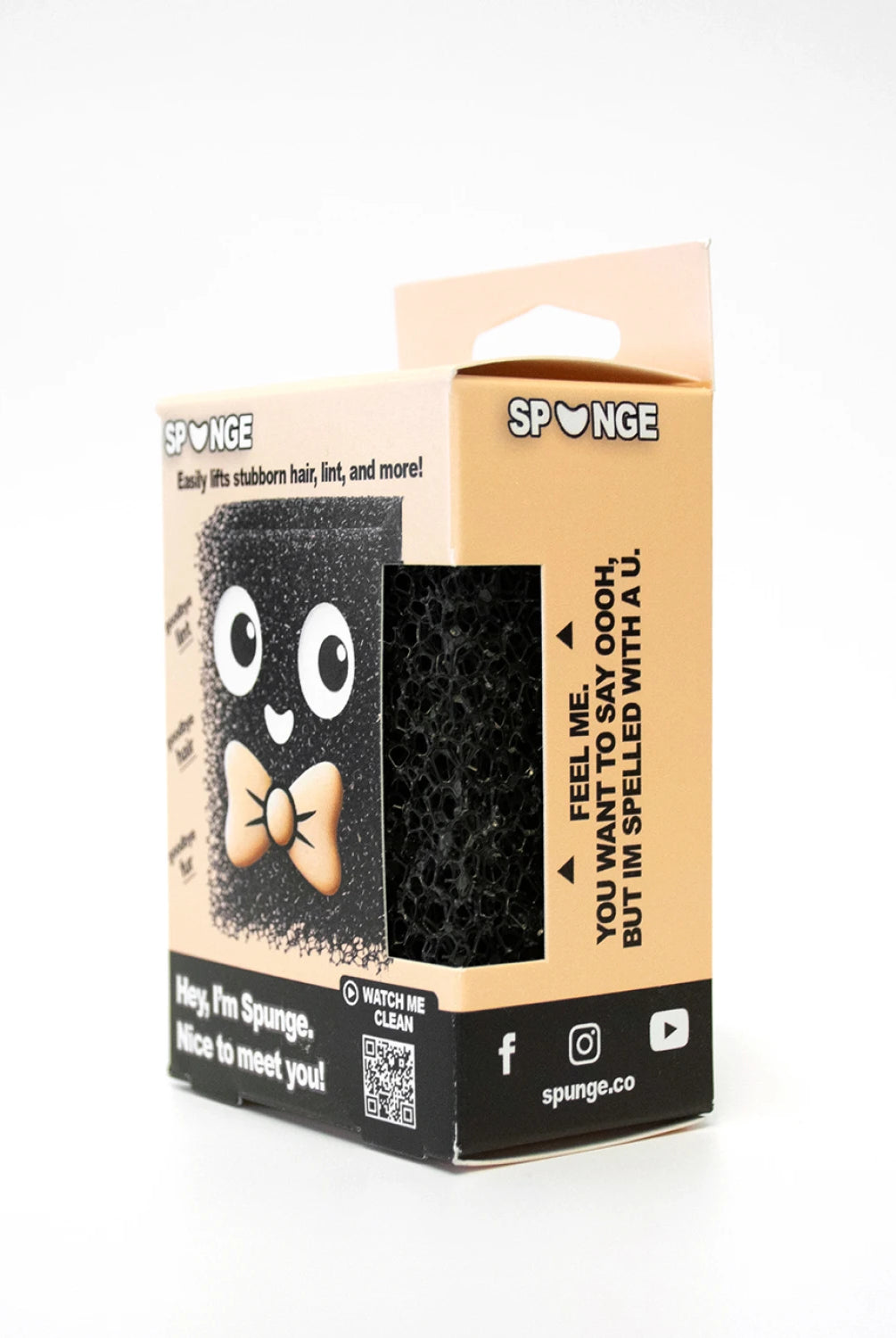 Black sponge with googly eyes and a bow tie on a beige packaging box with 'Sponge' branding.