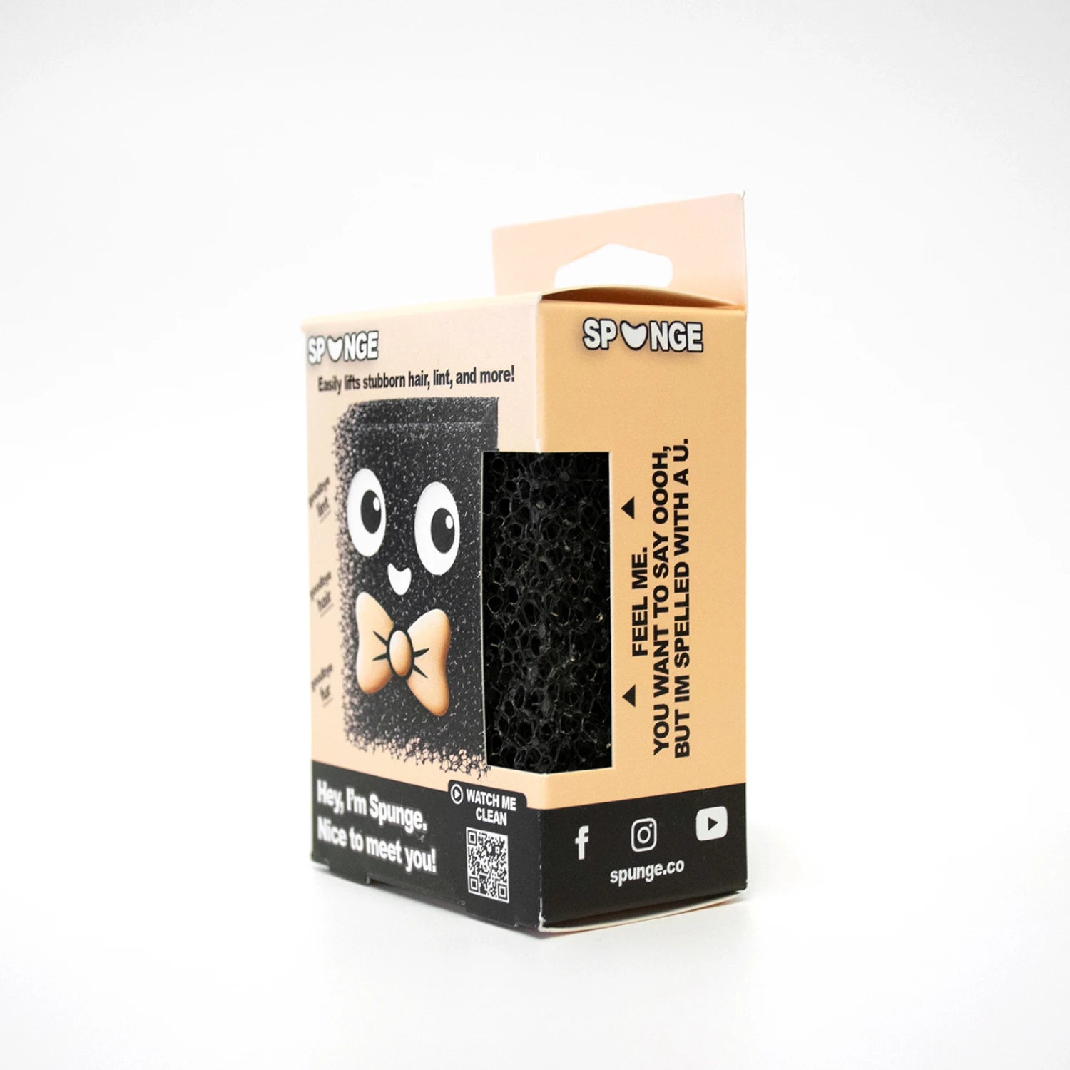 Black sponge with googly eyes and a bow tie on a beige packaging box with 'Sponge' branding.