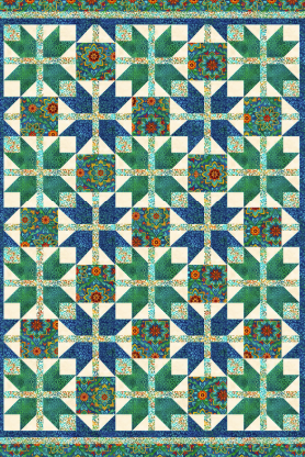 Quilt with a geometric pattern featuring green, blue, and white colors.