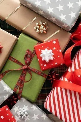 Carmon's Quilt Shop 24-day advent box featuring festive holiday gift-wrapped packages with red, green, and silver bows.