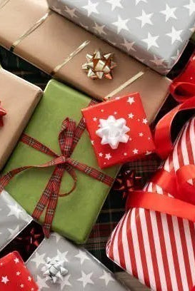 Carmon's Quilt Shop 24-day advent box featuring festive holiday gift-wrapped packages with red, green, and silver bows.