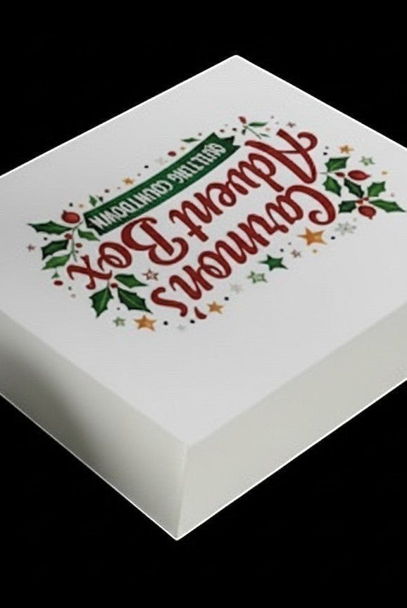Carmon's Quilt Shop limited-edition holiday advent box with festive holly and star branding on a white gift box.