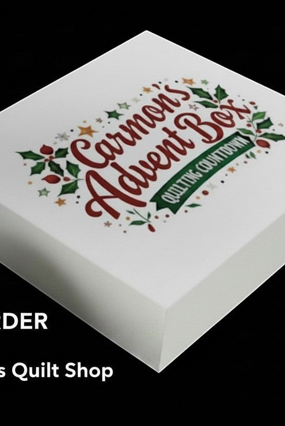 Carmon's Quilt Shop 24-day quilting advent calendar box with festive holiday branding on a white gift box