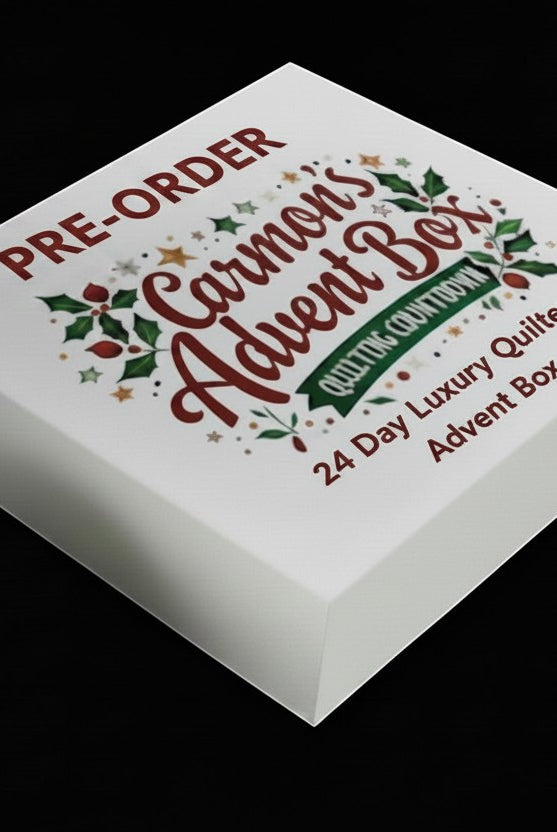 Carmon's Quilt Shop 24-day quilting advent box featuring festive holiday branding and luxury sewing notions.