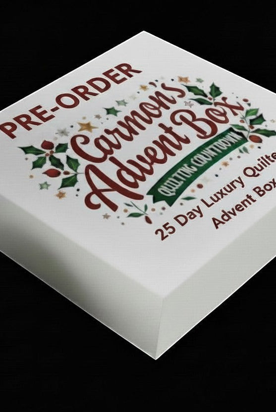 Carmon's Quilt Shop 25-day luxury quilting advent box with festive holiday branding on a white gift box.