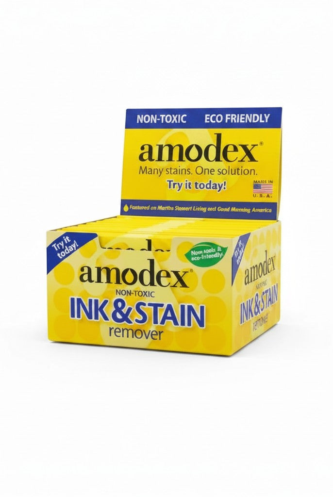 Carmon's Quilt Shop Amodex ink and stain remover trial pack in a yellow display box for fabrics and surfaces