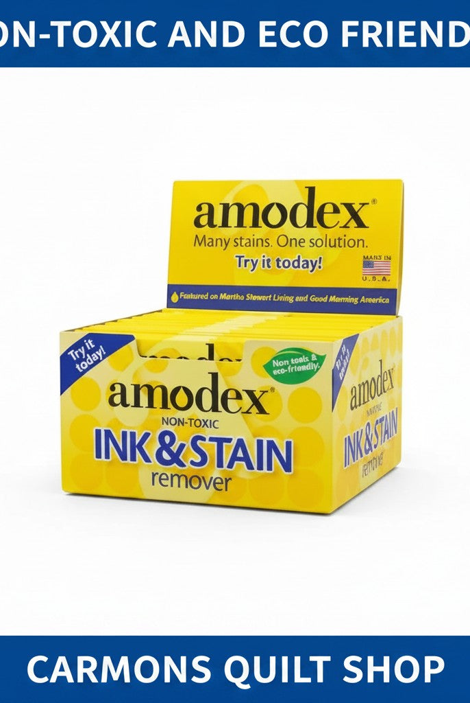 Carmon's Quilt Shop Amodex ink and stain remover trial pack in a yellow display box for fabrics and surfaces