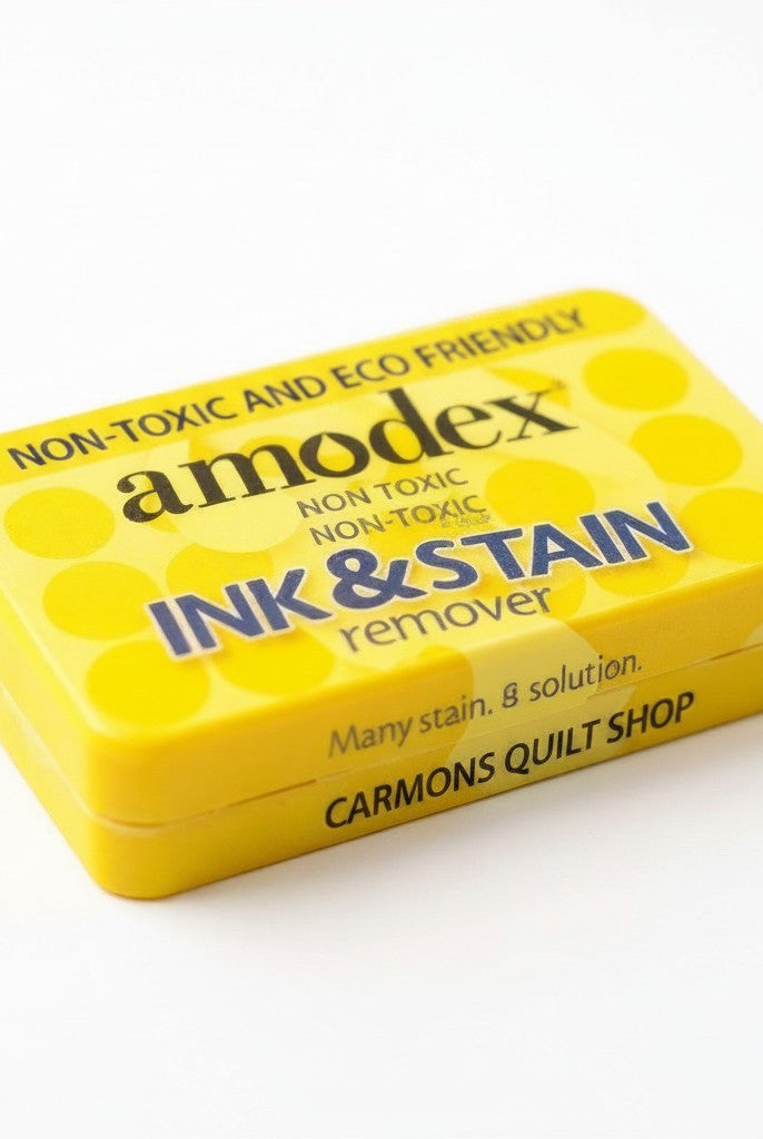 Carmon's Quilt Shop Amodex ink and stain remover trial pack in a yellow eco-friendly container