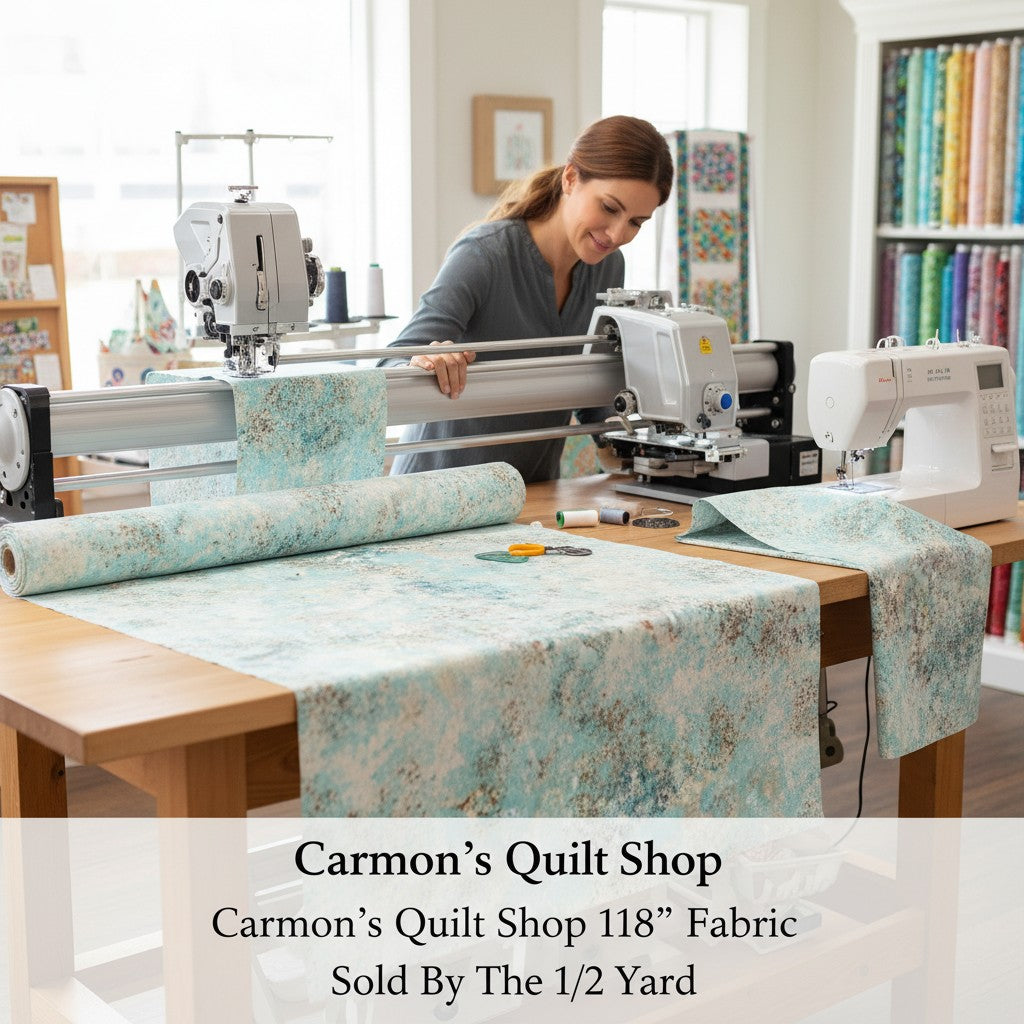 Carmon's Quilt Shop light aqua mottled texture 118 inch cotton quilting fabric on a longarm machine