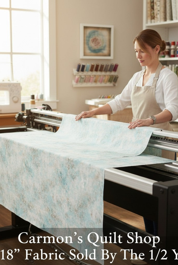 Carmon's Quilt Shop light aqua mottled texture 118 inch wide cotton quilting fabric on a longarm machine