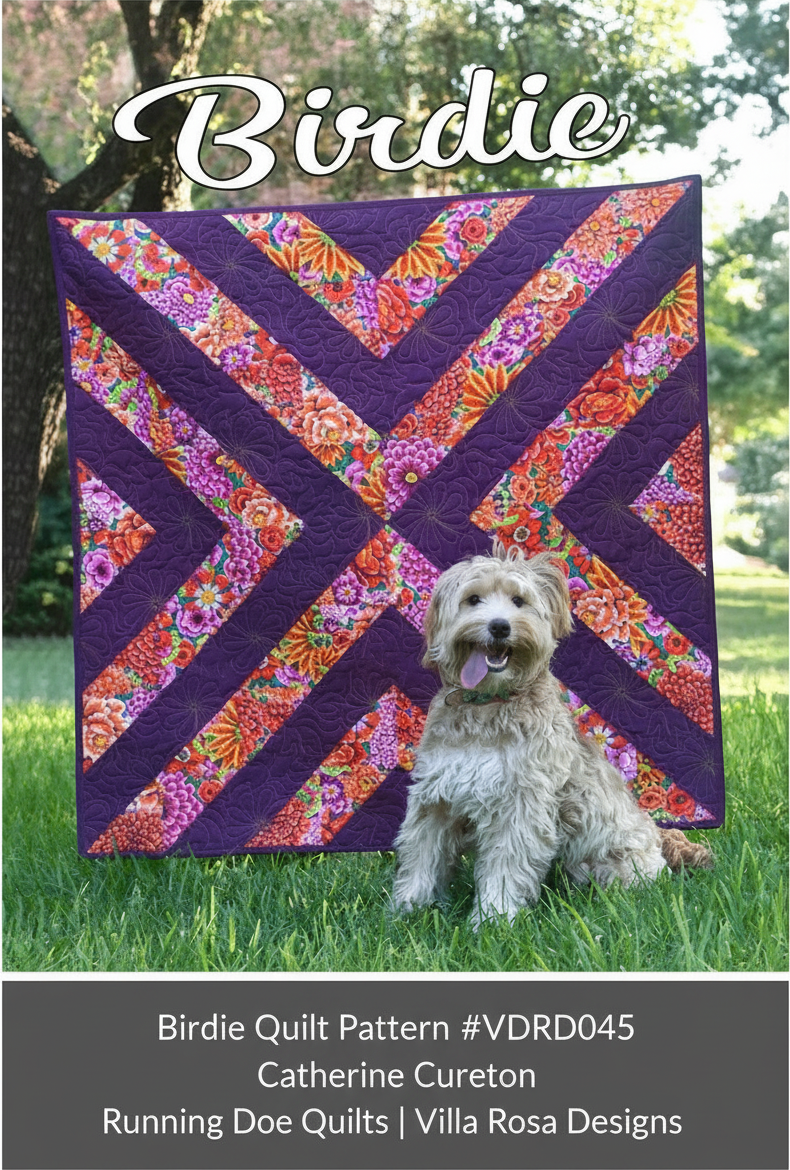Carmon's Quilt Shop Birdie quilt pattern featuring a purple and floral geometric design with a dog on a lawn