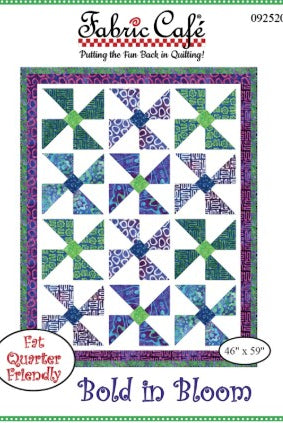 Carmon's Quilt Shop Fabric Café Bold in Bloom quilt pattern featuring a vibrant pinwheel design in blue and green.