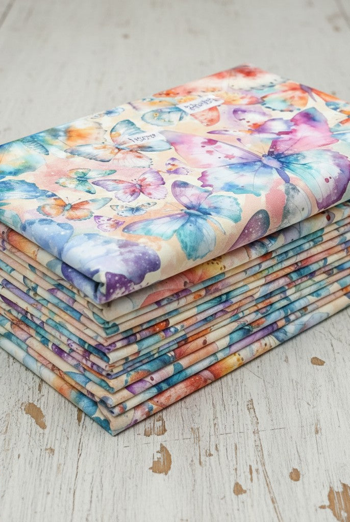 Carmon's Quilt Shop Butterfly Wishes cream 108-inch wide cotton quilt backing fabric with colorful butterfly print