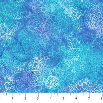 Carmon's Quilt Shop Coral Reef fabric by Northcott featuring a blue and purple aquatic coral pattern for quilting.