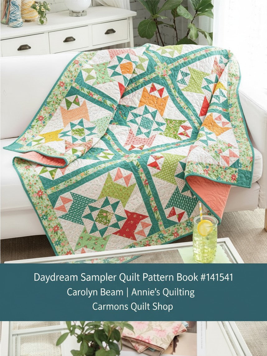 Carmon's Quilt Shop Daydream Sampler quilt featuring colorful pieced blocks in green, orange, and pink floral fabrics