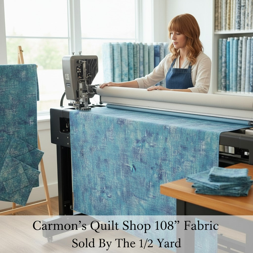 Carmon's Quilt Shop 108 inch denim blue mottled cotton blender fabric being used on a longarm quilting machine