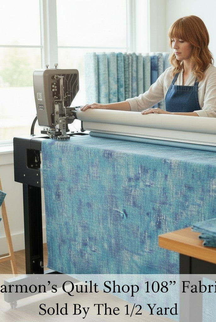Carmon's Quilt Shop QT Fabrics denim blue mottled 108-inch wide cotton quilting fabric on a longarm machine