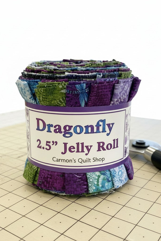 Carmon's Quilt Shop Dragonfly Wonder 2.5 inch jelly roll featuring 40 pre-cut cotton fabric strips in purple and green