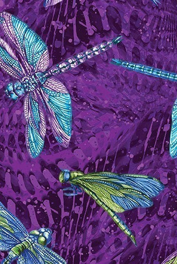 Carmon's Quilt Shop Dragonfly Wonder cotton fabric featuring vibrant blue and green dragonflies on a purple background