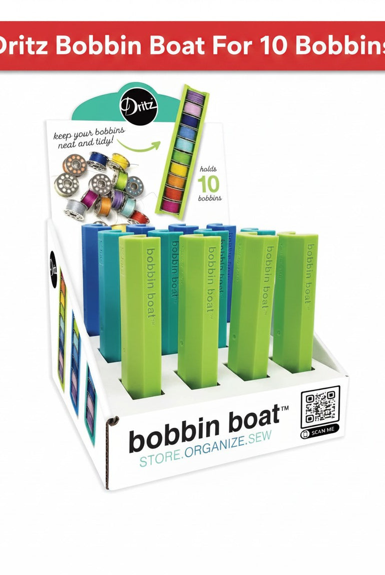 Carmon's Quilt Shop Dritz Bobbin Boat display rack holding colorful sewing bobbins for organized storage