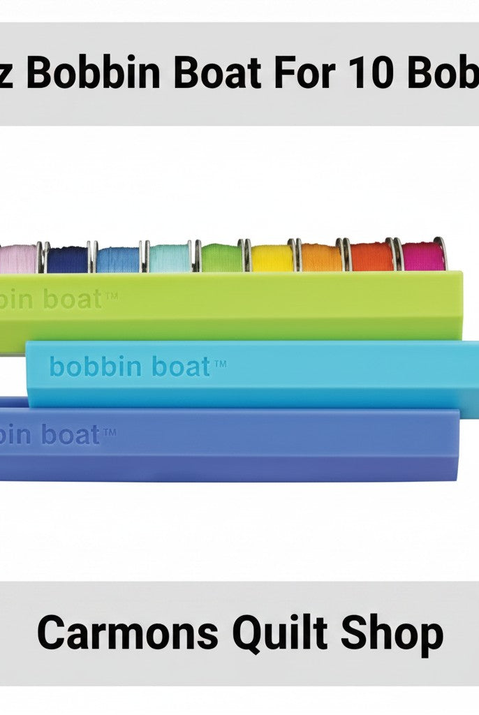 Carmon's Quilt Shop Dritz Bobbin Boat organizers in green, blue, and purple for storing sewing machine bobbins.