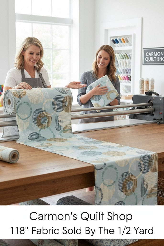 Carmon's Quilt Shop dusty aqua cotton fabric with overlapping circle geometric print on a longarm quilting machine