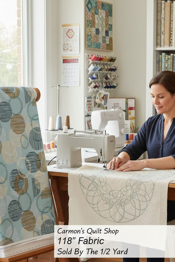 Carmon's Quilt Shop 118 inch dusty aqua cotton fabric with overlapping circle geometric print on a quilting frame