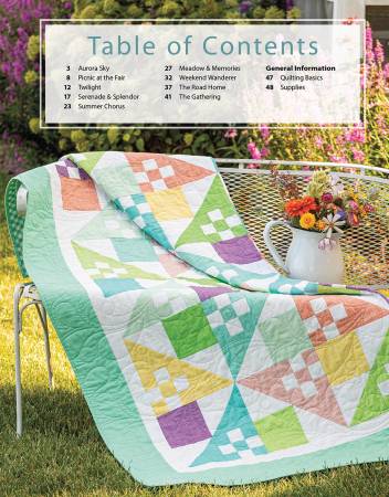 Carmon's Quilt Shop Forever Fabulous Fat Quarter Quilts book featuring a pastel pieced quilt on a garden chair