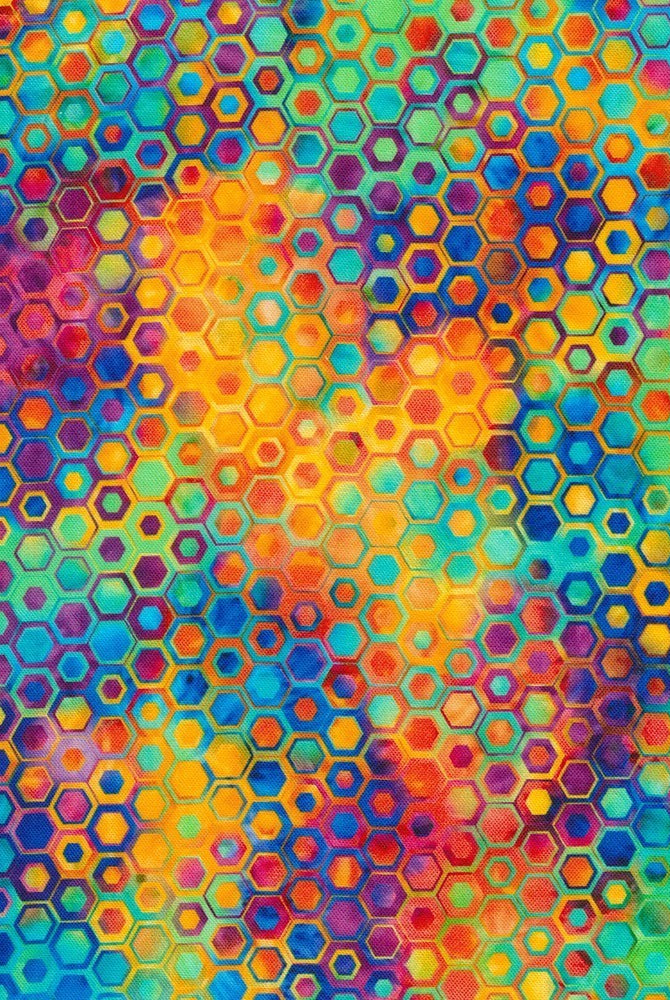 Carmon's Quilt Shop Fiesta Phantasma 108-inch cotton fabric with a vibrant, colorful hexagon and starburst pattern.