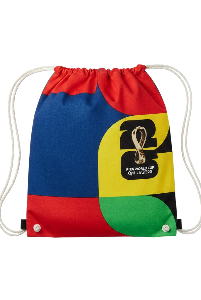 Carmon's Quilt Shop FIFA World Cup 26 drawstring backpack kit with bold red, blue, yellow, and green color blocks and official logo.