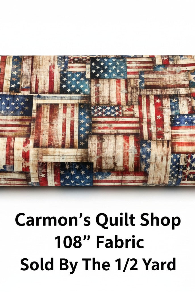Carmon's Quilt Shop 108 inch wide cotton fabric featuring a rustic red, white, and blue American flag patchwork print.