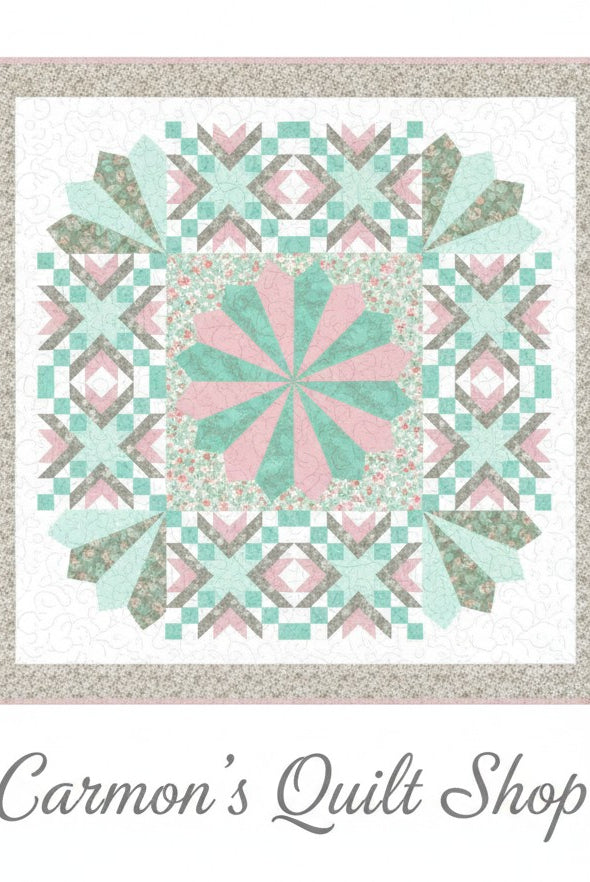 Carmon's Quilt Shop Floating Dresden quilt kit in soft pink, green, and floral cotton prints with a geometric design.